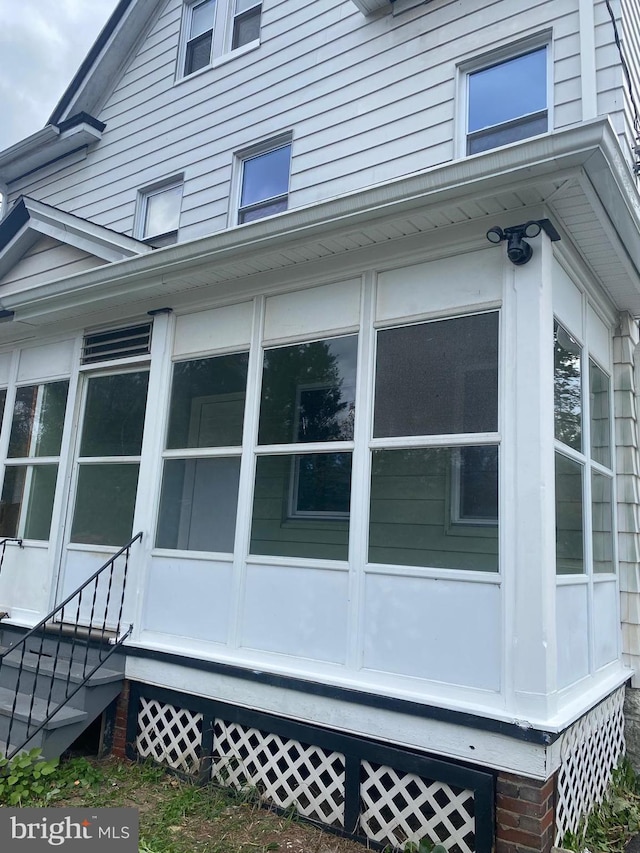 view of home's exterior featuring a sunroom