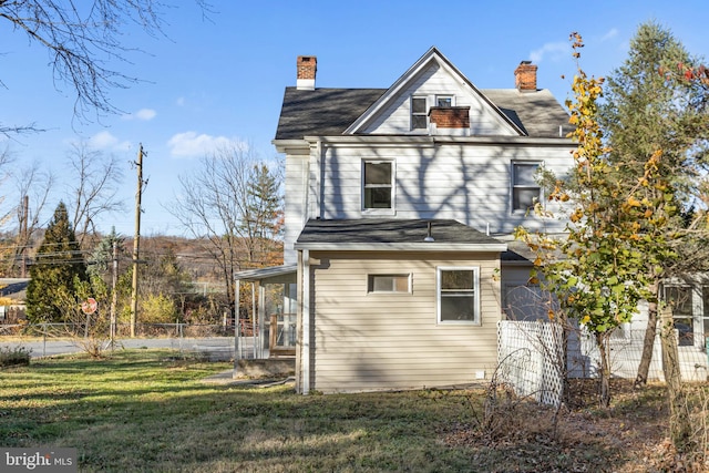 view of home's exterior with a yard