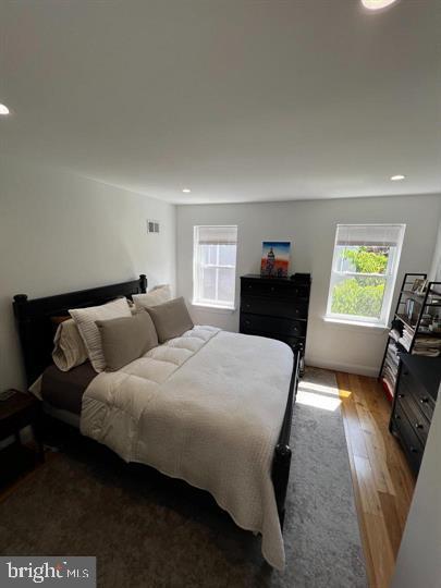 bedroom featuring wood-type flooring