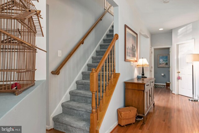 stairway with wood-type flooring