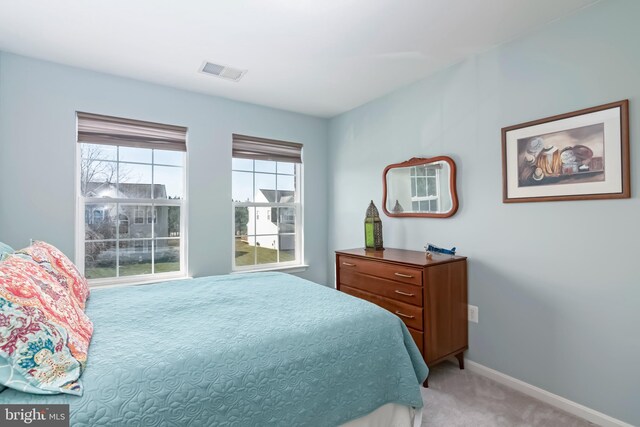 bedroom with light carpet