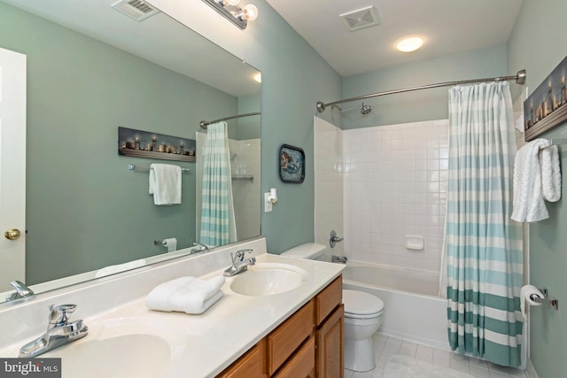 full bathroom featuring tile patterned floors, vanity, shower / bath combo, and toilet