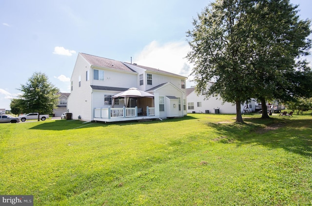 back of house featuring a yard