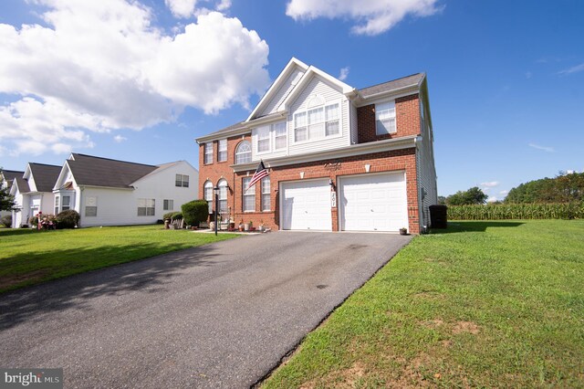 view of front facade featuring a garage and a front lawn