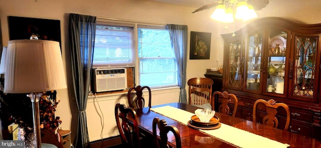 dining space featuring ceiling fan and cooling unit