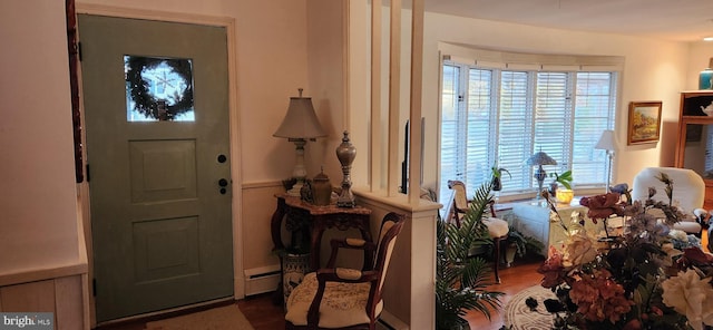 entrance foyer with baseboard heating and wood finished floors