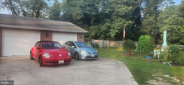 garage featuring a yard