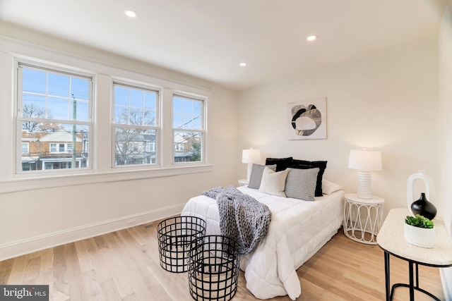 bedroom with light wood-type flooring