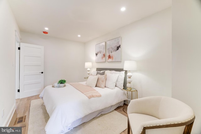 bedroom with light hardwood / wood-style flooring