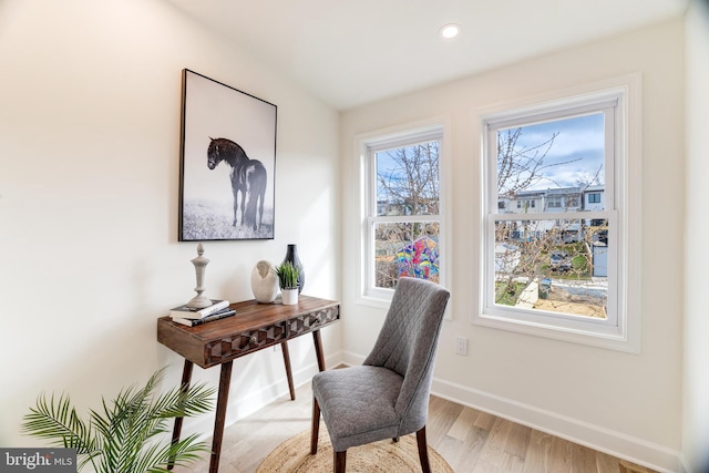 home office featuring plenty of natural light and light hardwood / wood-style floors