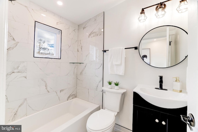 full bathroom with vanity, toilet, and tiled shower / bath