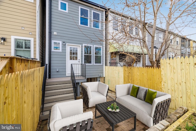 rear view of house with outdoor lounge area