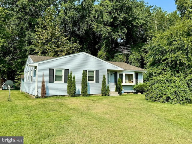 ranch-style home with a front yard