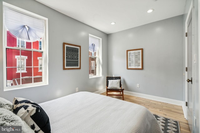 bedroom with hardwood / wood-style floors