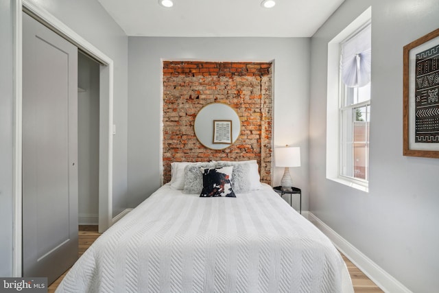 bedroom featuring hardwood / wood-style flooring