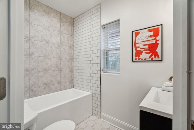 bathroom with vanity, toilet, and tile patterned flooring