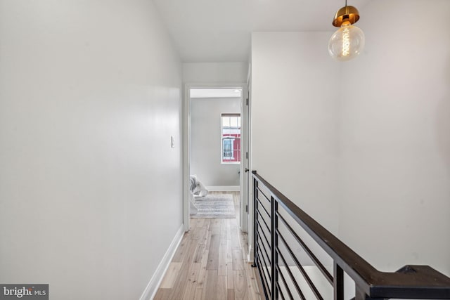 hall with light hardwood / wood-style flooring