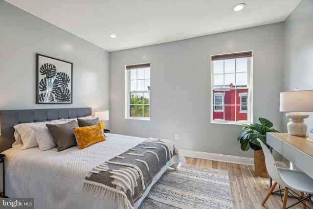 bedroom with light hardwood / wood-style floors