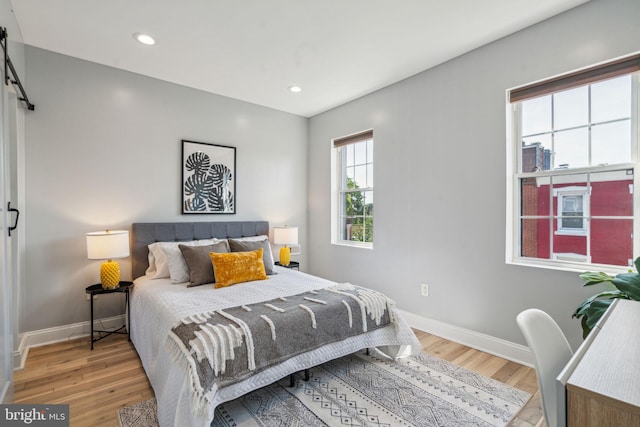 bedroom with light hardwood / wood-style flooring