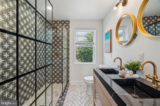 bathroom featuring vanity, toilet, walk in shower, and tile patterned flooring