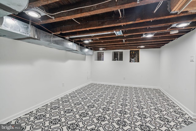 basement with tile patterned floors