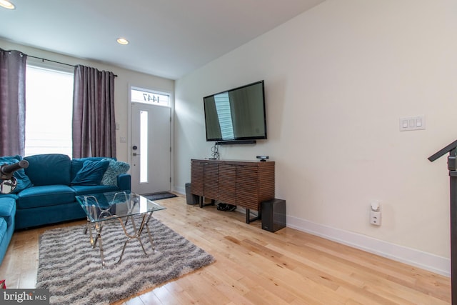 living room with light hardwood / wood-style flooring