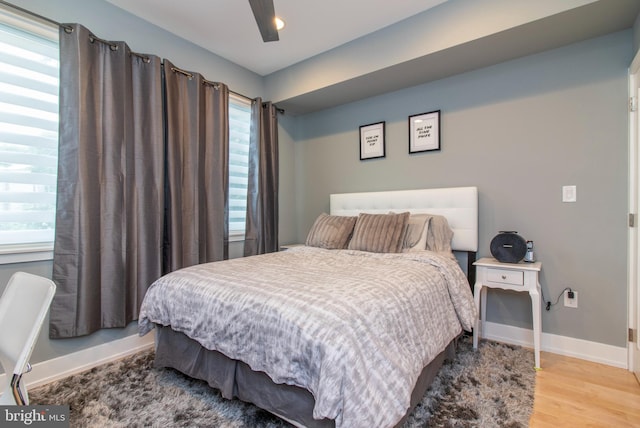 bedroom featuring ceiling fan and hardwood / wood-style flooring