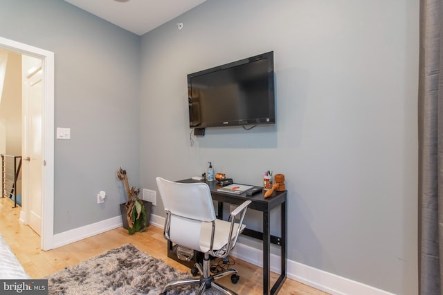 office area with light hardwood / wood-style flooring