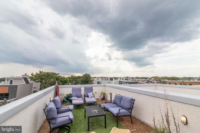 view of patio featuring a balcony and an outdoor hangout area