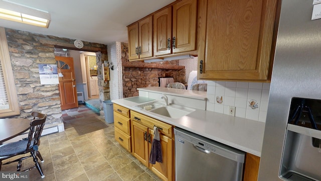 kitchen with light tile patterned flooring, backsplash, sink, stainless steel dishwasher, and radiator