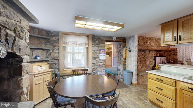 tiled dining area with washer and clothes dryer