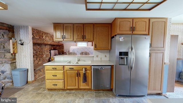 kitchen featuring sink, tasteful backsplash, light tile patterned flooring, and stainless steel appliances