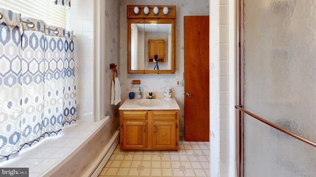 bathroom with tile patterned flooring, vanity, and shower / bathtub combination with curtain