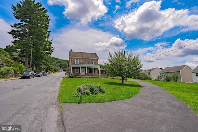 view of front of home with a front yard