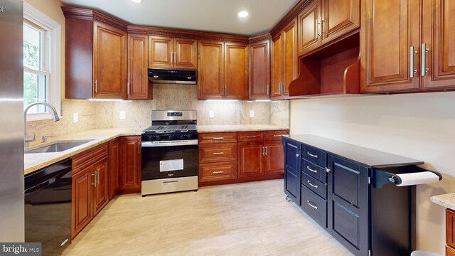 kitchen featuring black dishwasher, sink, stainless steel gas stove, extractor fan, and decorative backsplash