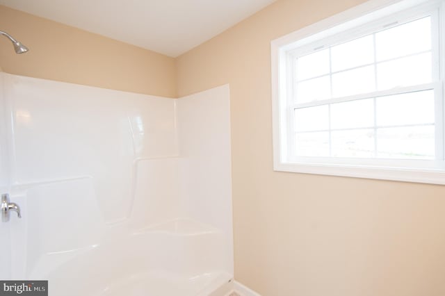 bathroom featuring walk in shower