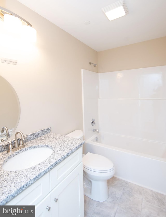 full bathroom featuring bathing tub / shower combination, tile patterned floors, vanity, and toilet