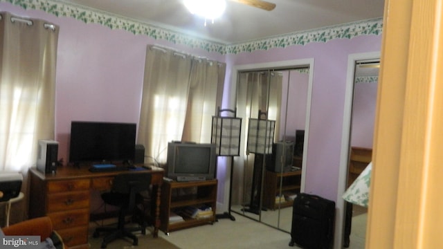 office area with carpet and ceiling fan