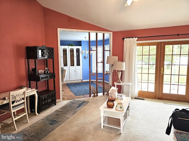 living room featuring carpet floors and lofted ceiling