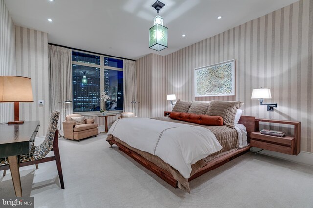 bedroom with light colored carpet