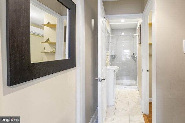 hall featuring light tile patterned floors