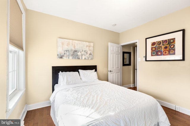 bedroom featuring dark wood-type flooring