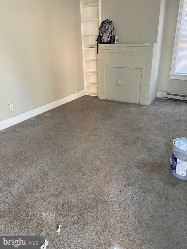 unfurnished living room featuring a fireplace and carpet flooring