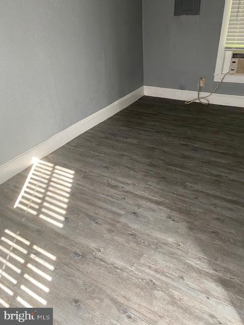 spare room featuring dark hardwood / wood-style floors