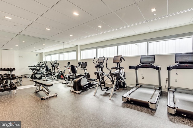 exercise room featuring a drop ceiling