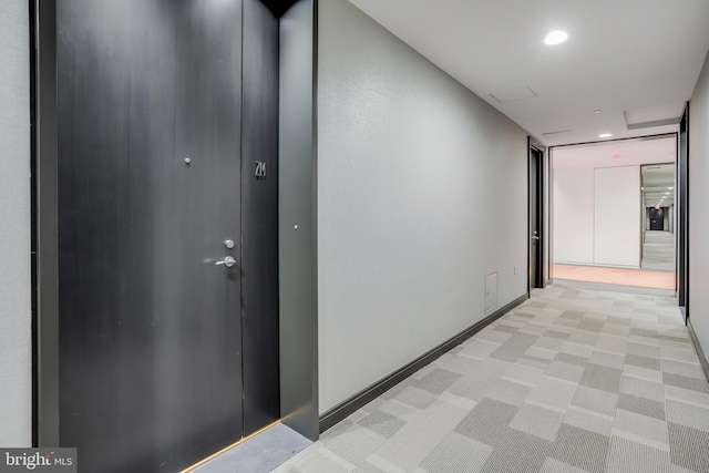 hallway with light carpet