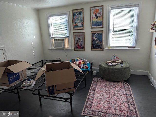 interior space with wood-type flooring and cooling unit