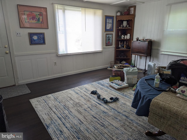 living room with dark hardwood / wood-style flooring