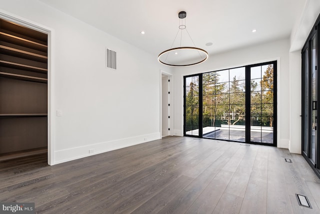 empty room featuring dark wood-type flooring