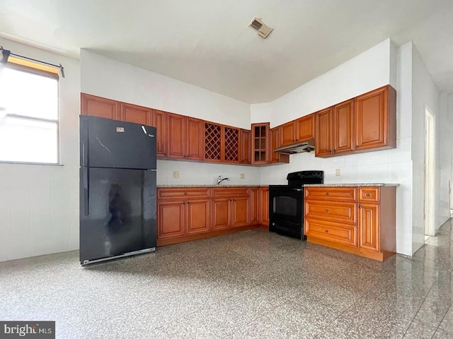 kitchen with black appliances and sink